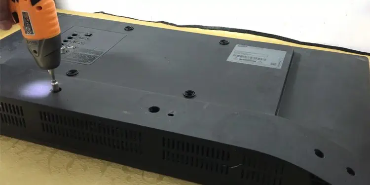 unscrew-screws-from-back-panel