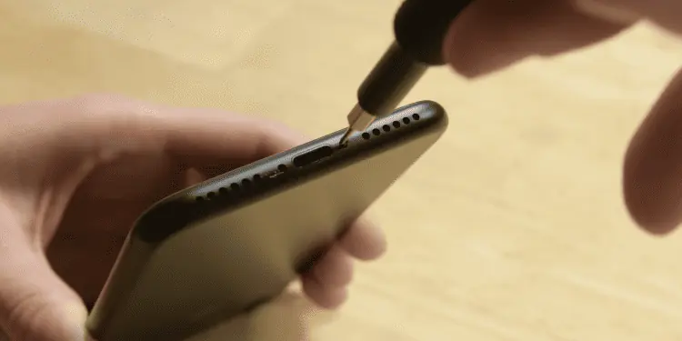 1-Unscrew-pins-next-to-the-charging-port-