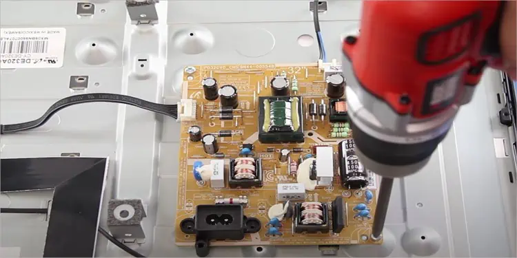 Samsung TV Red Light Blinking? Here’s How to Fix It 17 unscrew-PSU-from-TV-casing