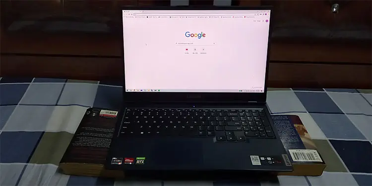 How to Safely Use Laptop on Bed Without Overheating It 3 using-book-as-a-stand
