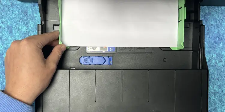 How to Put Paper in HP Printer 7 tighten-the-paper-using-guides-in-front-tray-1