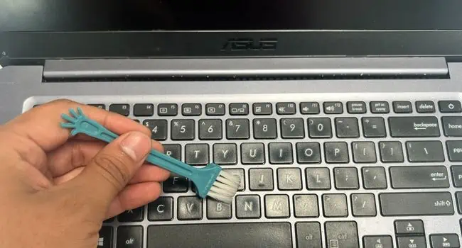 brush-to-clean-laptop-keypad