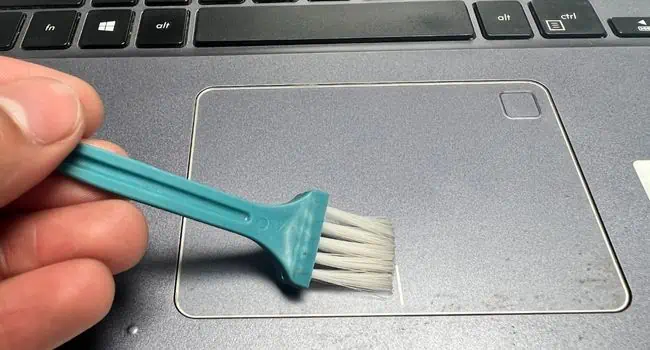 brush-to-clean-laptop-touchpad