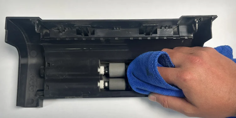 How to Clean a Printer (Complete Guide) 19 clean-adf-roller-with-lint-free-cloth