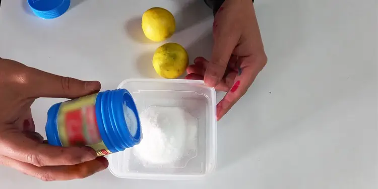 pouring-baking-powder-in-container-1