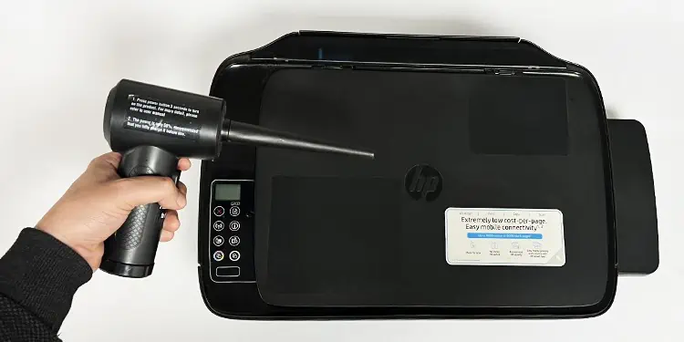 How to Clean a Printer (Complete Guide) 2 use-blower-to-blow-exterior-of-printer