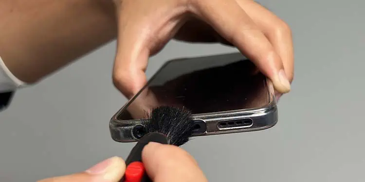 How to Get Sand Out of Charging Port 6 brushing-charging-port