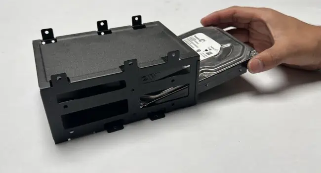 How to Install a Hard Drive? (Step-By-Step Guide) 15 removing-hdd-from-cage