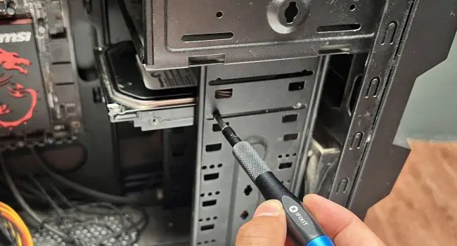 How to Install a Hard Drive? (Step-By-Step Guide) 10 untighten-hard-drive-screws