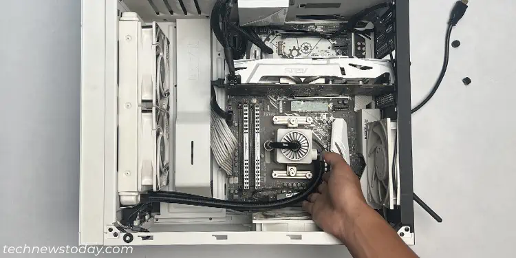 lay-pc-case-on-side-and-tap-radiator-pump-and-tubes