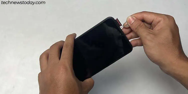 Water in Charging Port? 5 Proven Steps to Dry It Fast! 2 taking-out-sim-tray-1