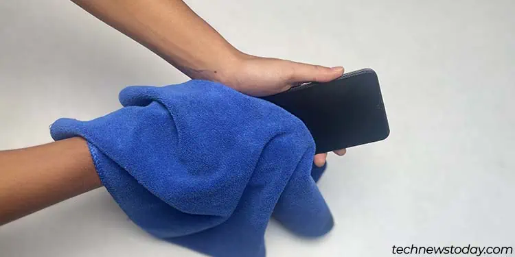Water in Charging Port? 5 Proven Steps to Dry It Fast! 3 wipe-off-excess-water-from-phone