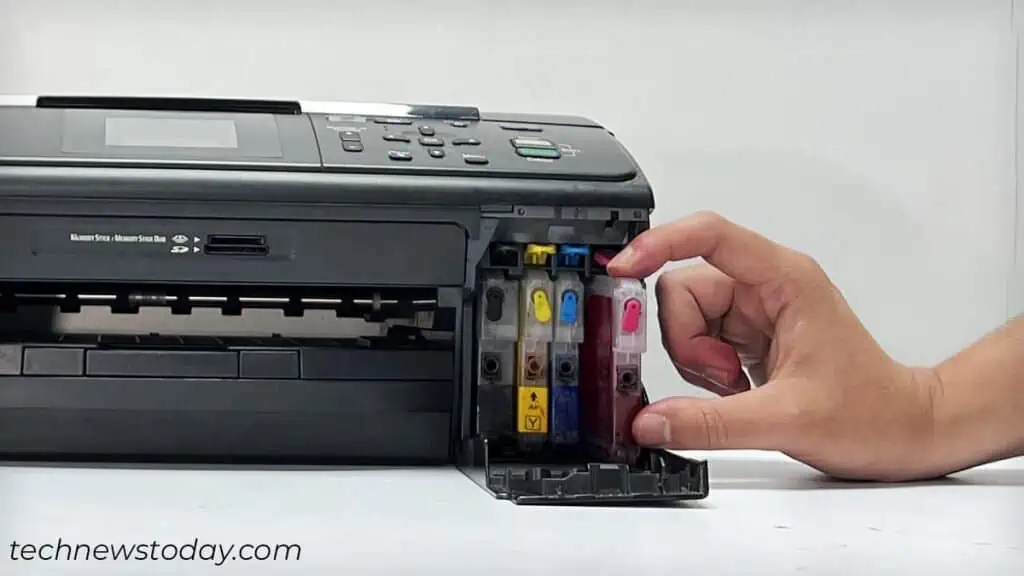 Printer Not Printing Black? Here's How to Fix It 3 replacing-cartridge-in-a-printer-1024x576