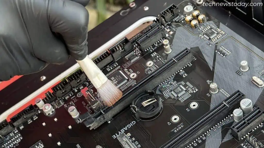 cleaning-dust-from-pcie-slots-after-motherboard-disassembly-1024x576