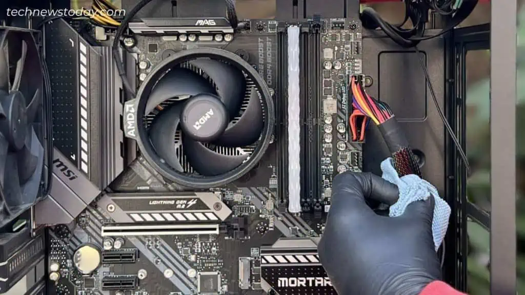 How to Clean Dust From PC 14 cleaning-using-microfiber-towel-power-connector-cable-1024x576