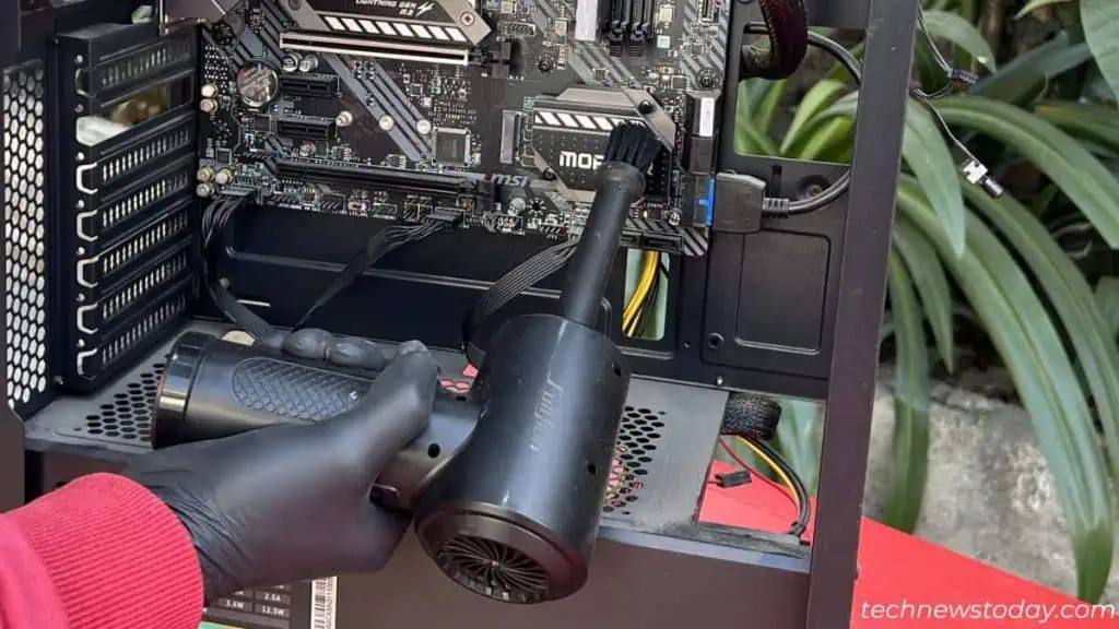 How to Clean Dust From PC 10 dusting-off-motherboard-using-compressed-air-duster-1024x576