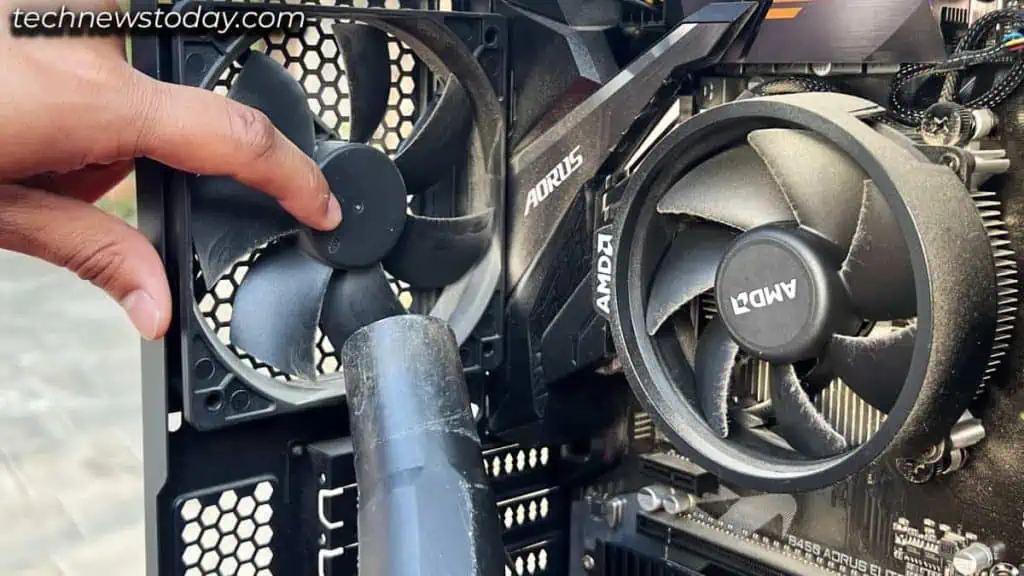 Is It Safe to Use Vacuum Cleaner to Clean a PC 5 hold-fans-before-cleaning-with-vacuum-cleaner-1-1024x576
